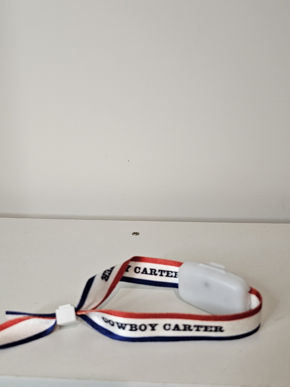 White Wireless Earbuds with Red, White & Blue Strap